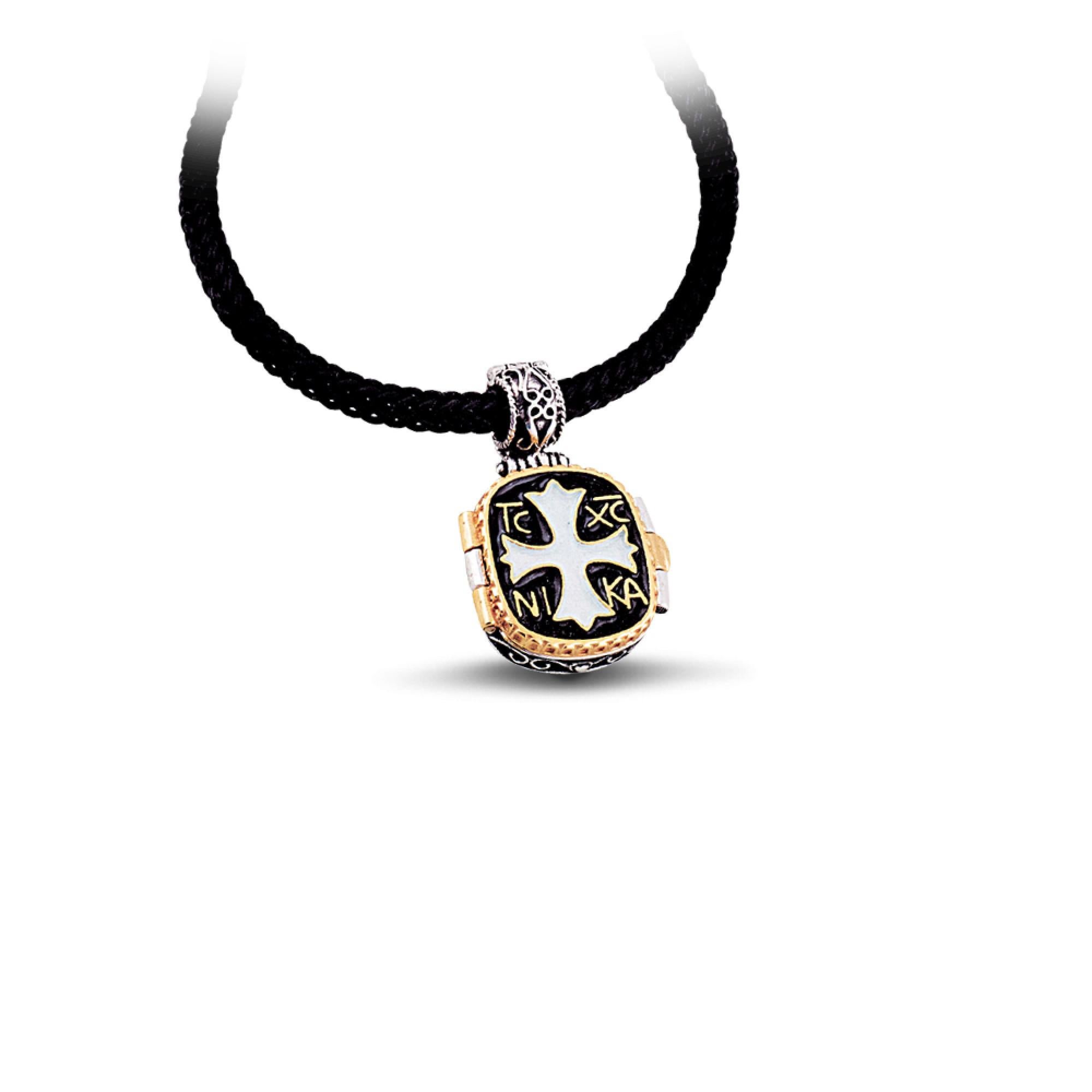 An unique sterling silver locket pendant from the Anax collection, with enamel touches on the top. 
The interior of the locket pendant has the representation of Saint George.

In Orthodox Christianity the well known Christian symbol, IC XC NI KA,