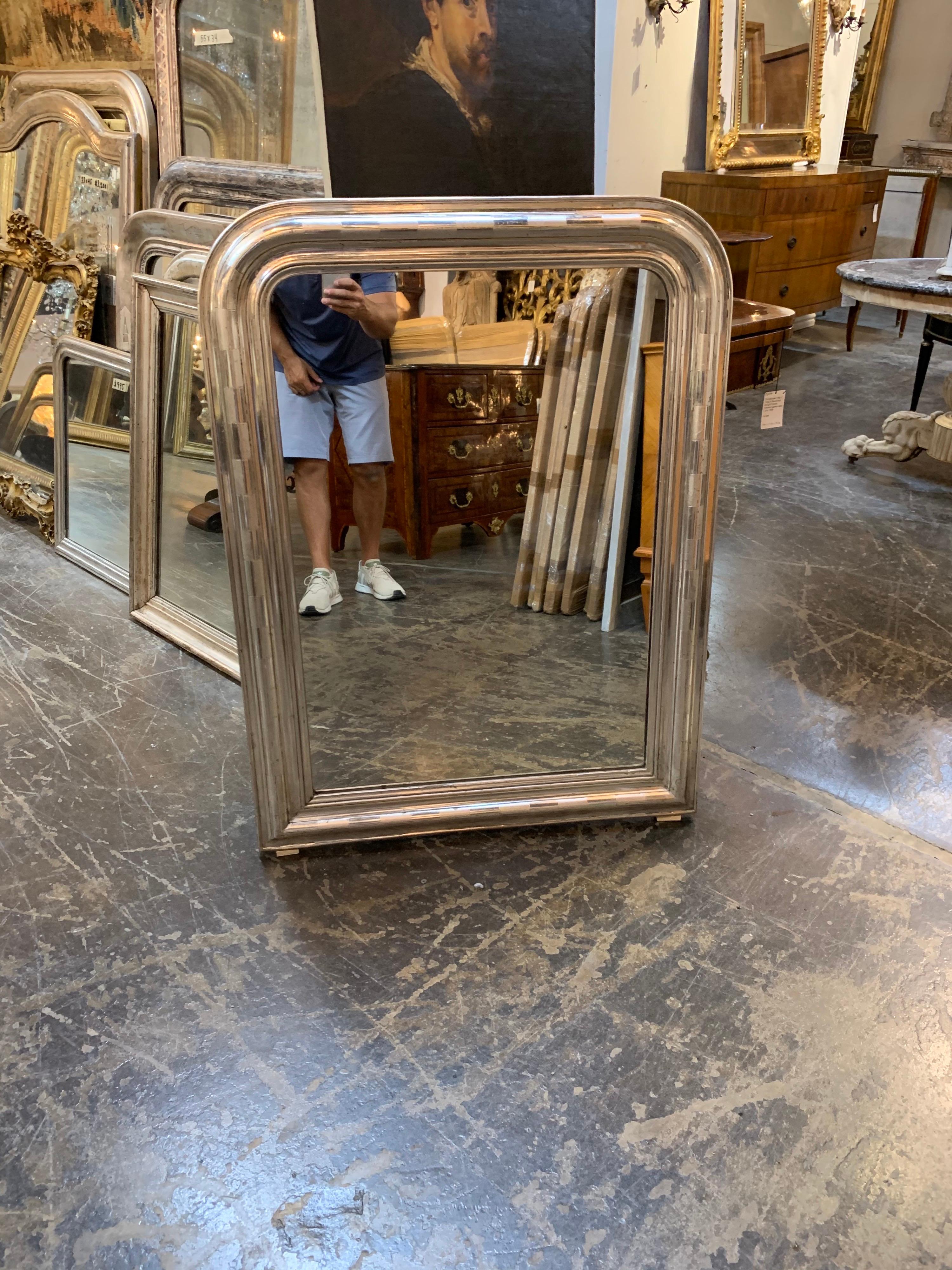 Stylish silver gilt Louis Philippe mirror. Fabulous polished finish with square pattern. Makes a beautiful statement!