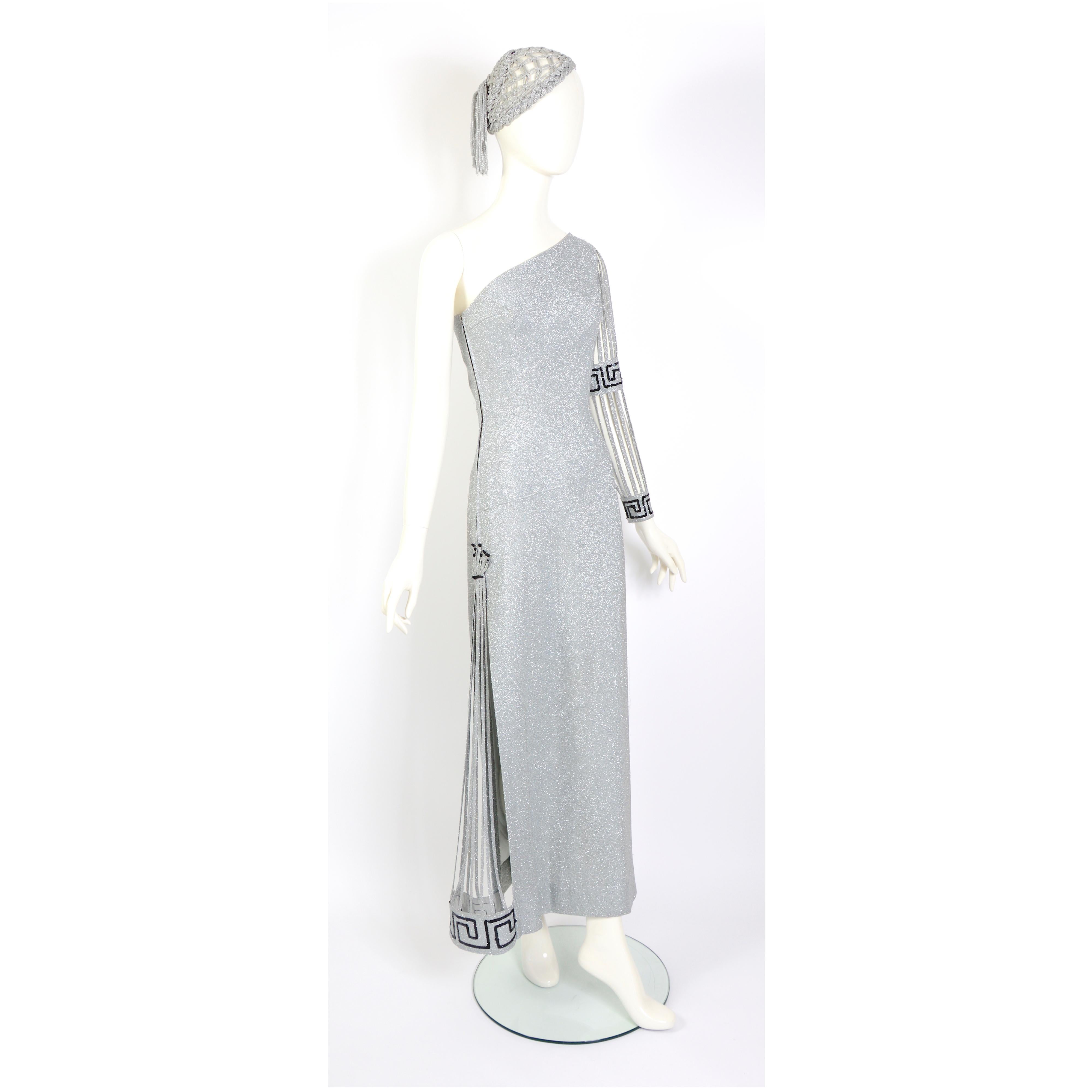 This could be the fun party dress you were looking for.
Gorgeous embellished silver lurex with black paillette one-sleeve and split-side party dress in the style of Pierre Cardin. We've been told that the dress is Pierre Cardin, but we can't confirm