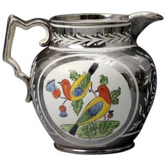 Silver Luster Pottery Pitcher with Enamel Colored Panels of Birds on a Thistle Silver Luster Pottery Pitcher with Enamel Colored Panels of Birds on a Thistle