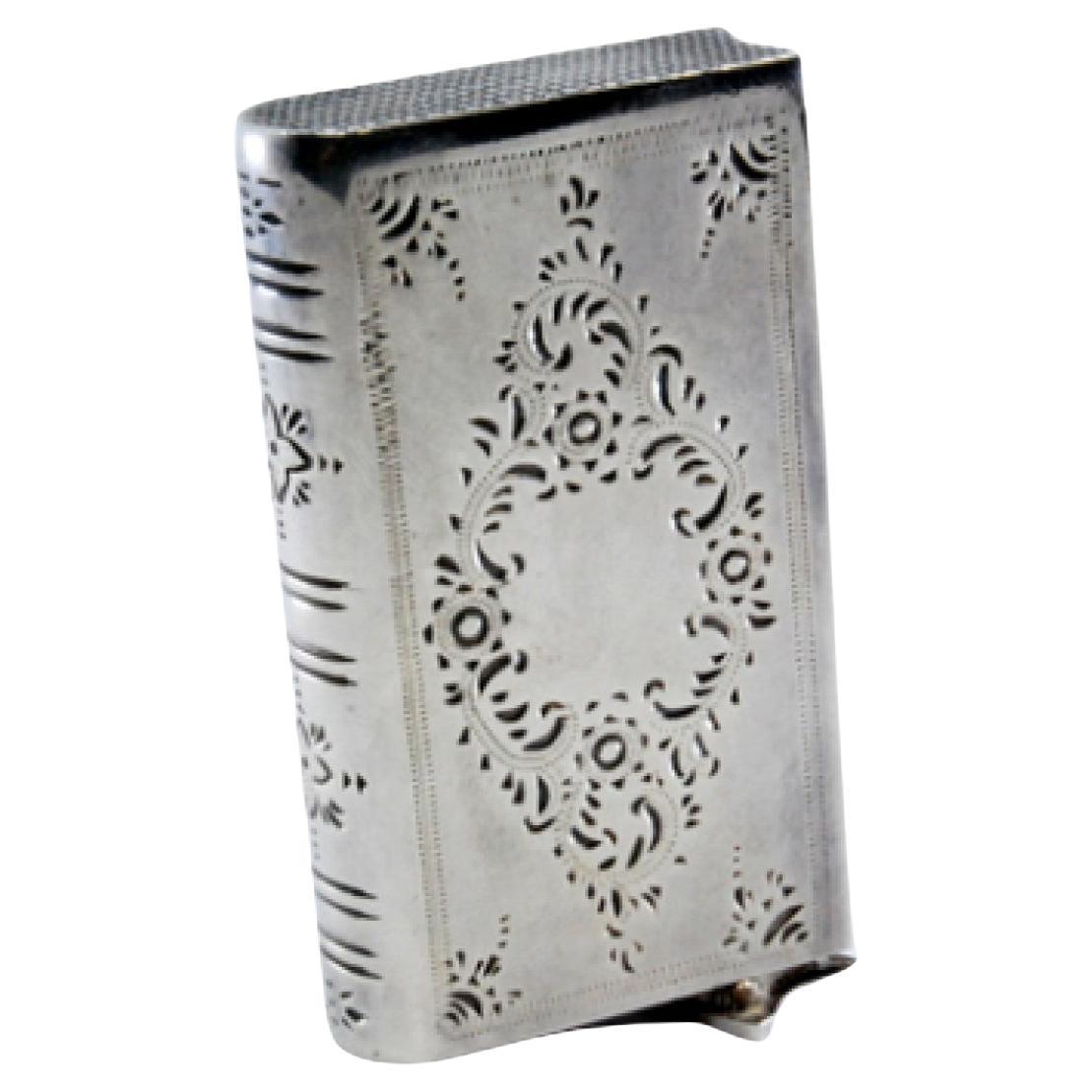 Silver matchbox book-shaped with plant engravings and sliding opening