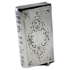 Silver matchbox book-shaped with plant engravings and sliding opening