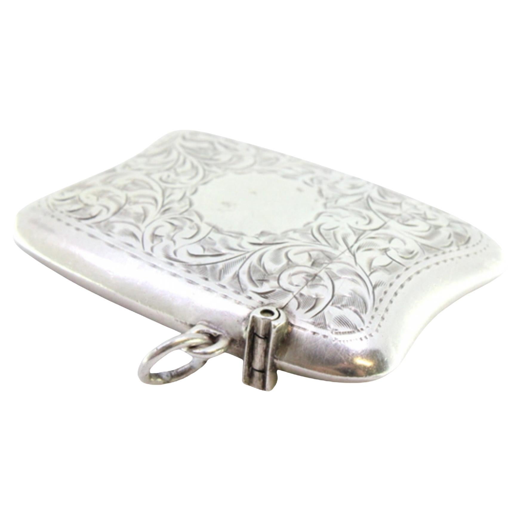 Silver matchbox with floral engravings, monogram and hanging ring