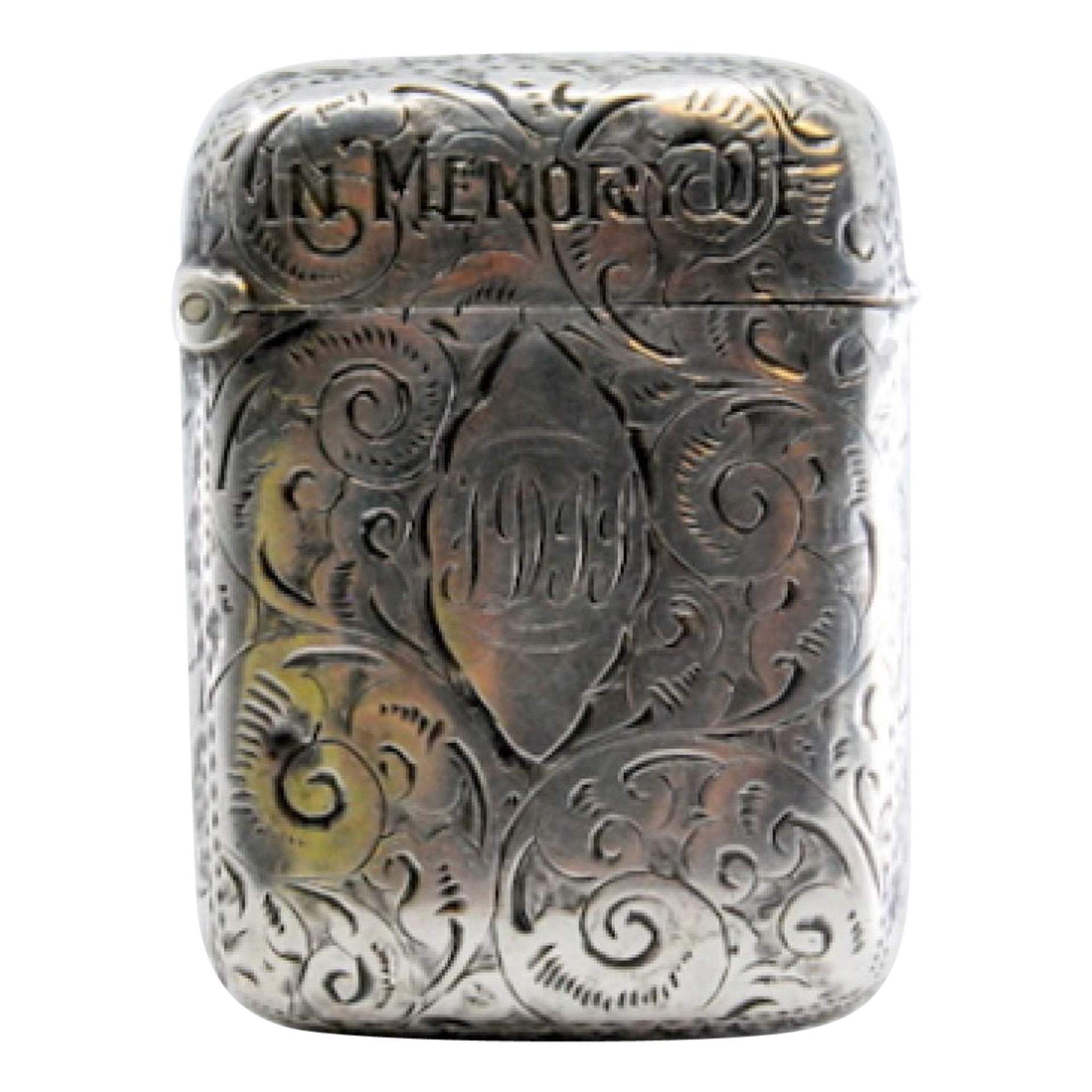 Silver matchstick with relief plant motifs surrounding monogram cartouche