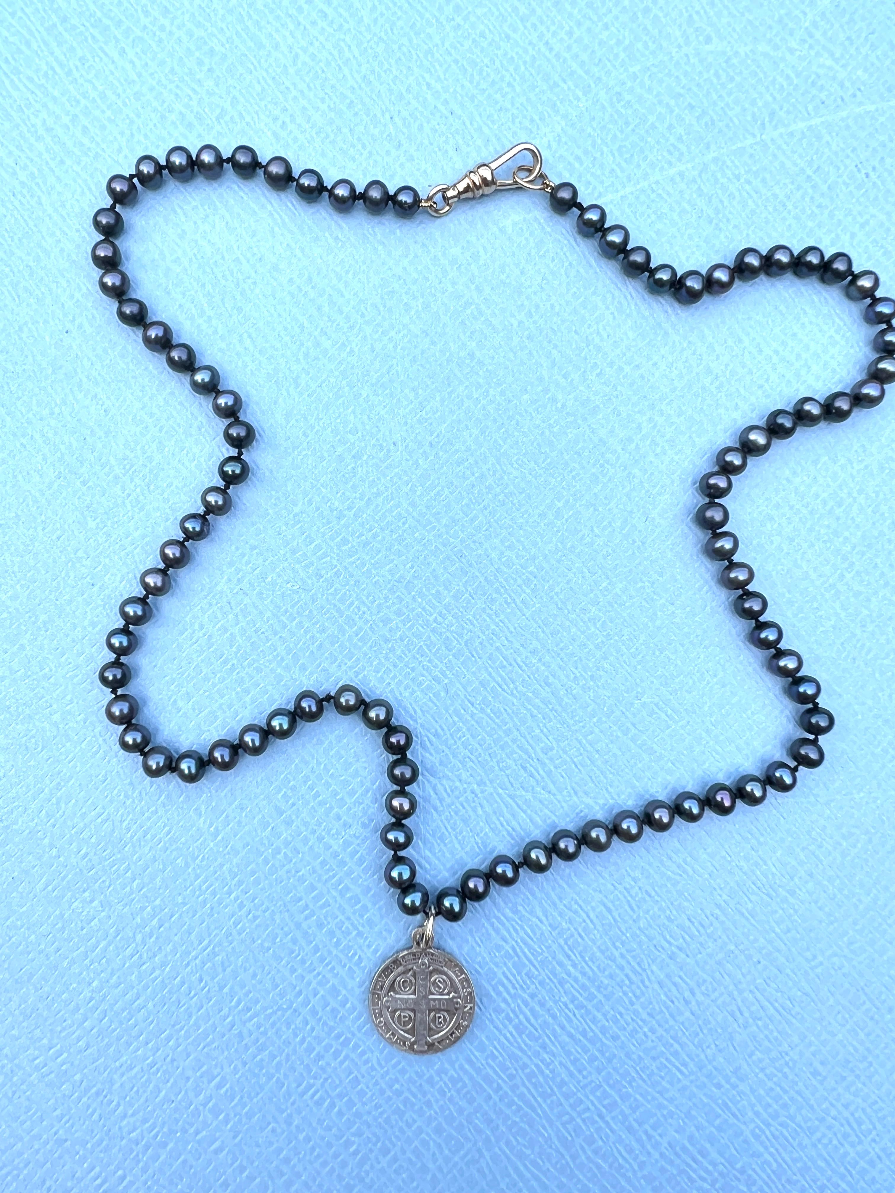 Silver Medal from France 
sitting on a Black Pearl Bead choker Necklace

18
