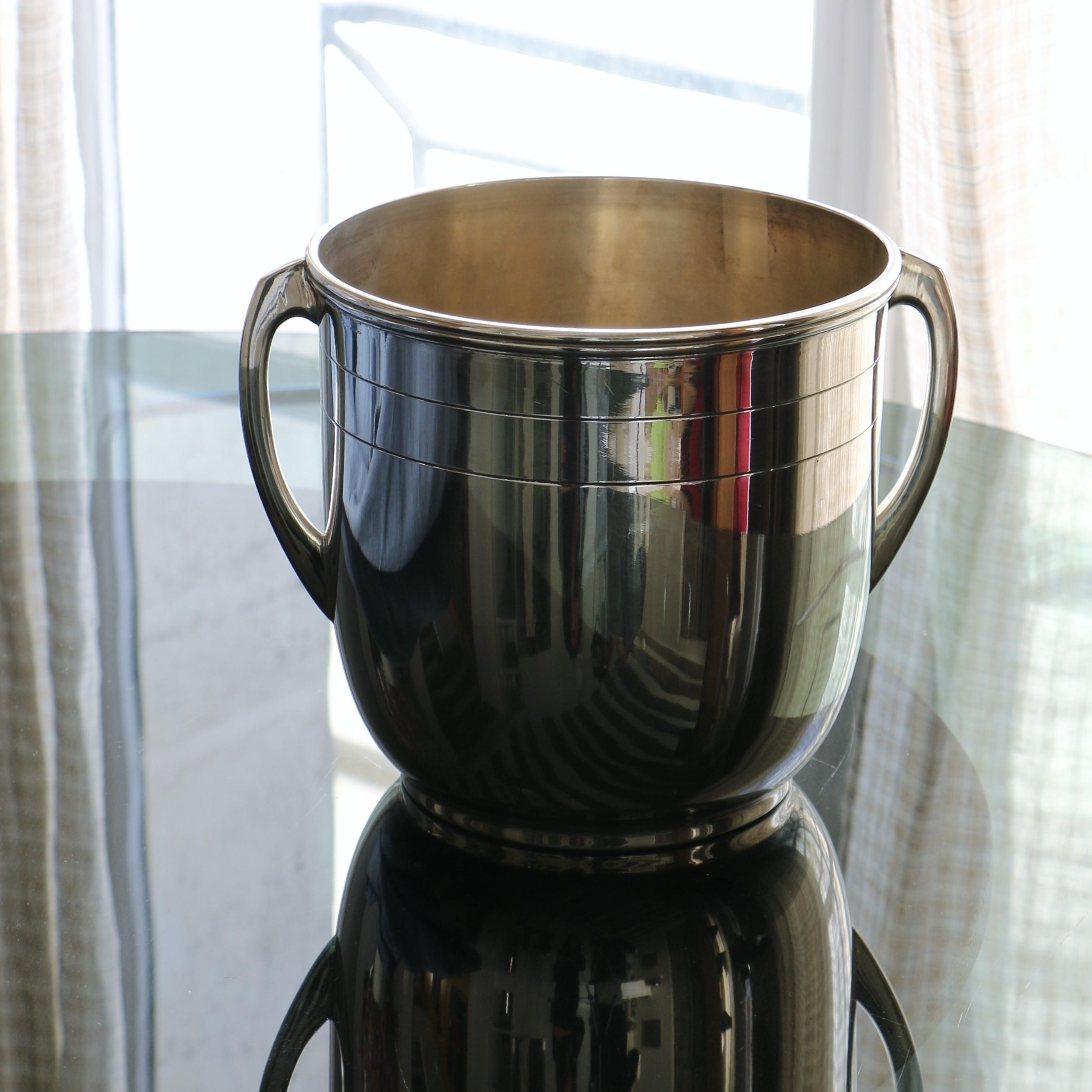Silver metal champagne bucket with clean lines.