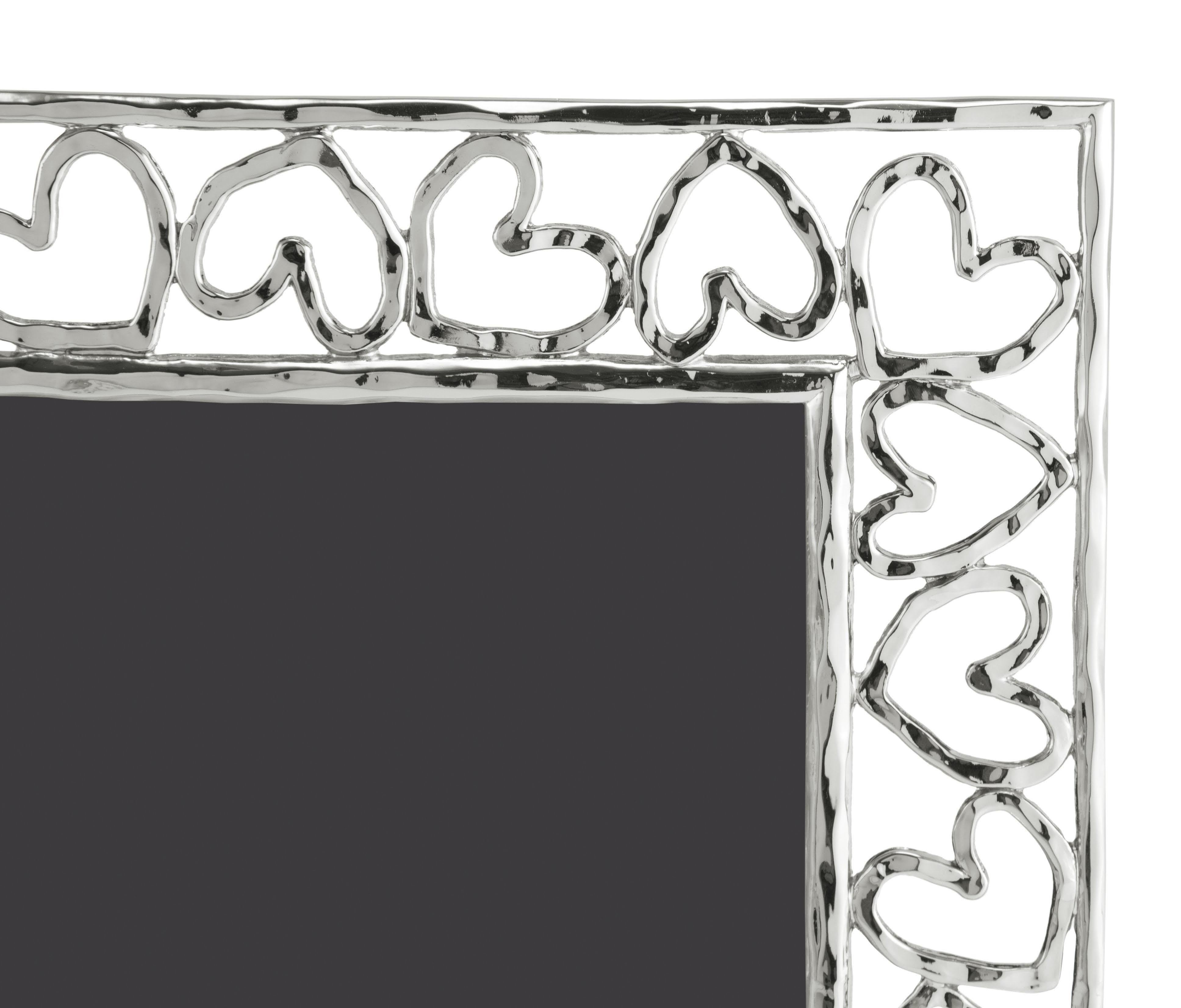 Silver metal heart photo frame, large model.

Show off your favourite photos in this heart-shaped photo frame. The heart collection is based on the simple yet universal symbol of love, hope, friendship and caring. Made from high-quality silver