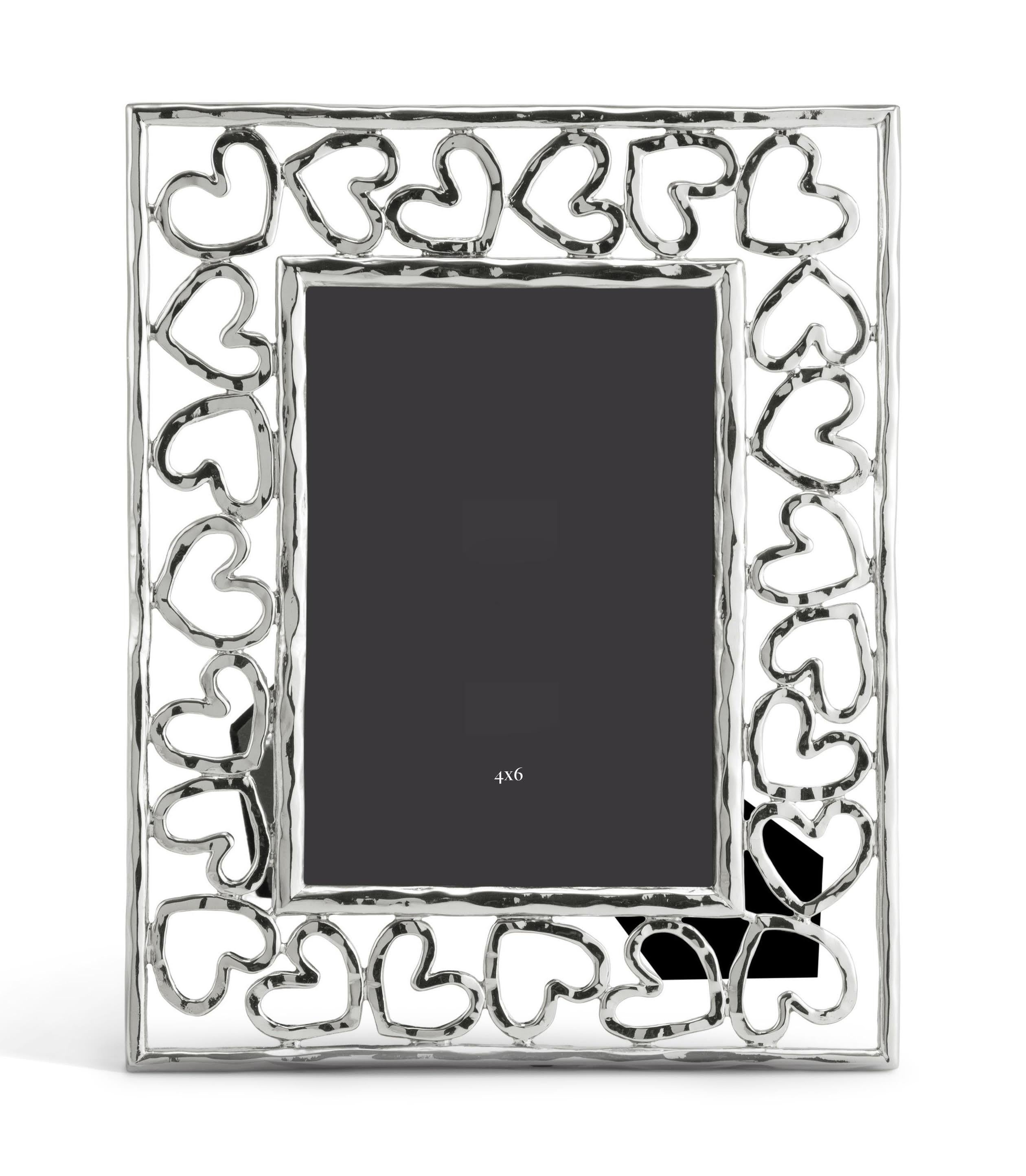 Silver metal heart photo frame, small model.

Show off your favourite photos in this heart-shaped photo frame. The heart collection is based on the simple yet universal symbol of love, hope, friendship and caring. Made from high-quality silver