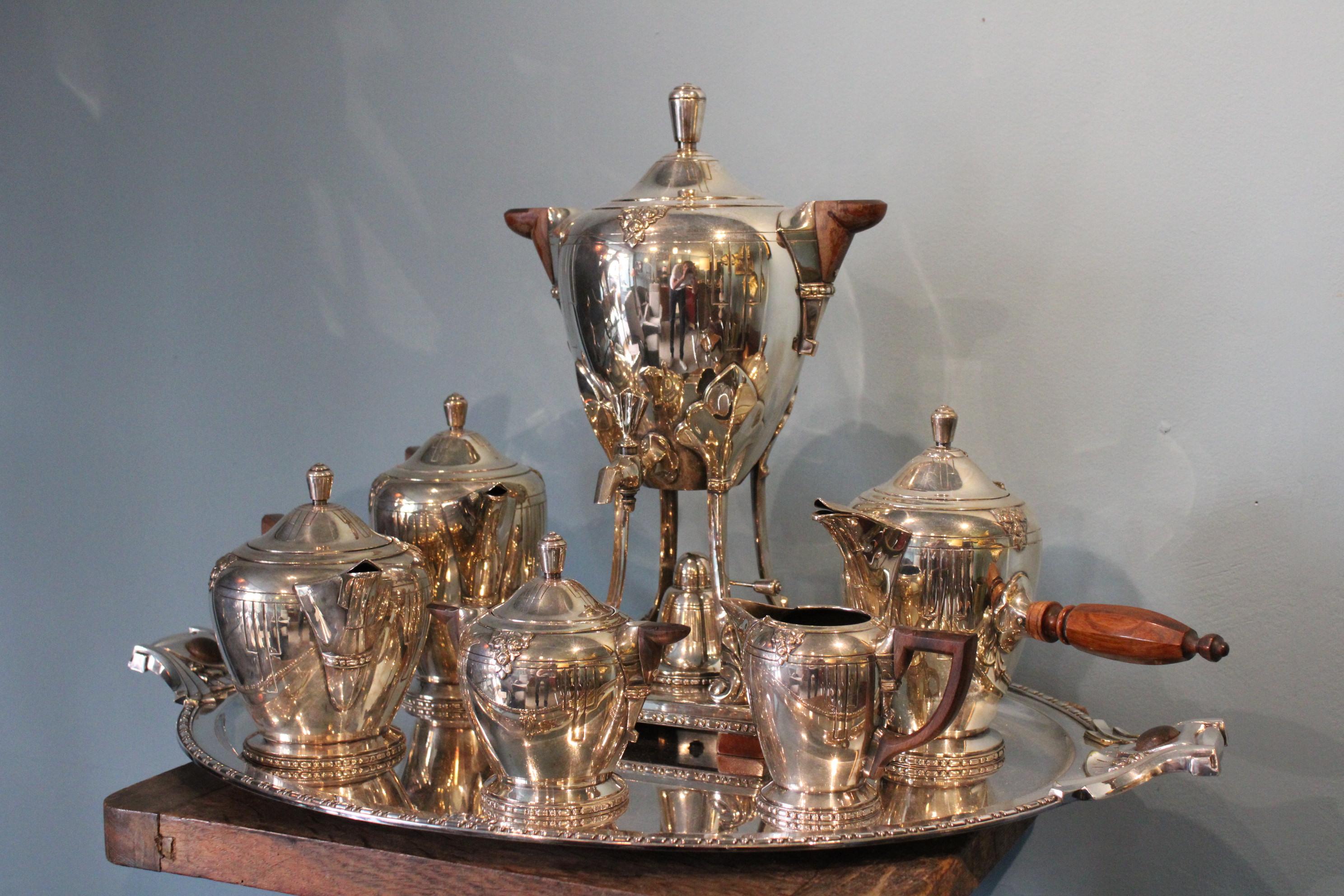 Silver metal service with tray.