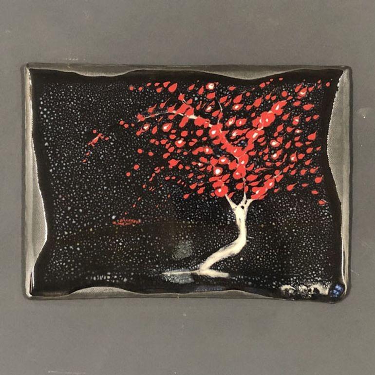 Framed Pottery by Tom Turnbull, the art depicts a nighttime landscape scene, of stars and an abstract tree with vibrant red leaves, framed by silver metal.

Created by Tom Turnbull of Turnbull Pottery based in Nashville, TN.

Dimensions: 17 x