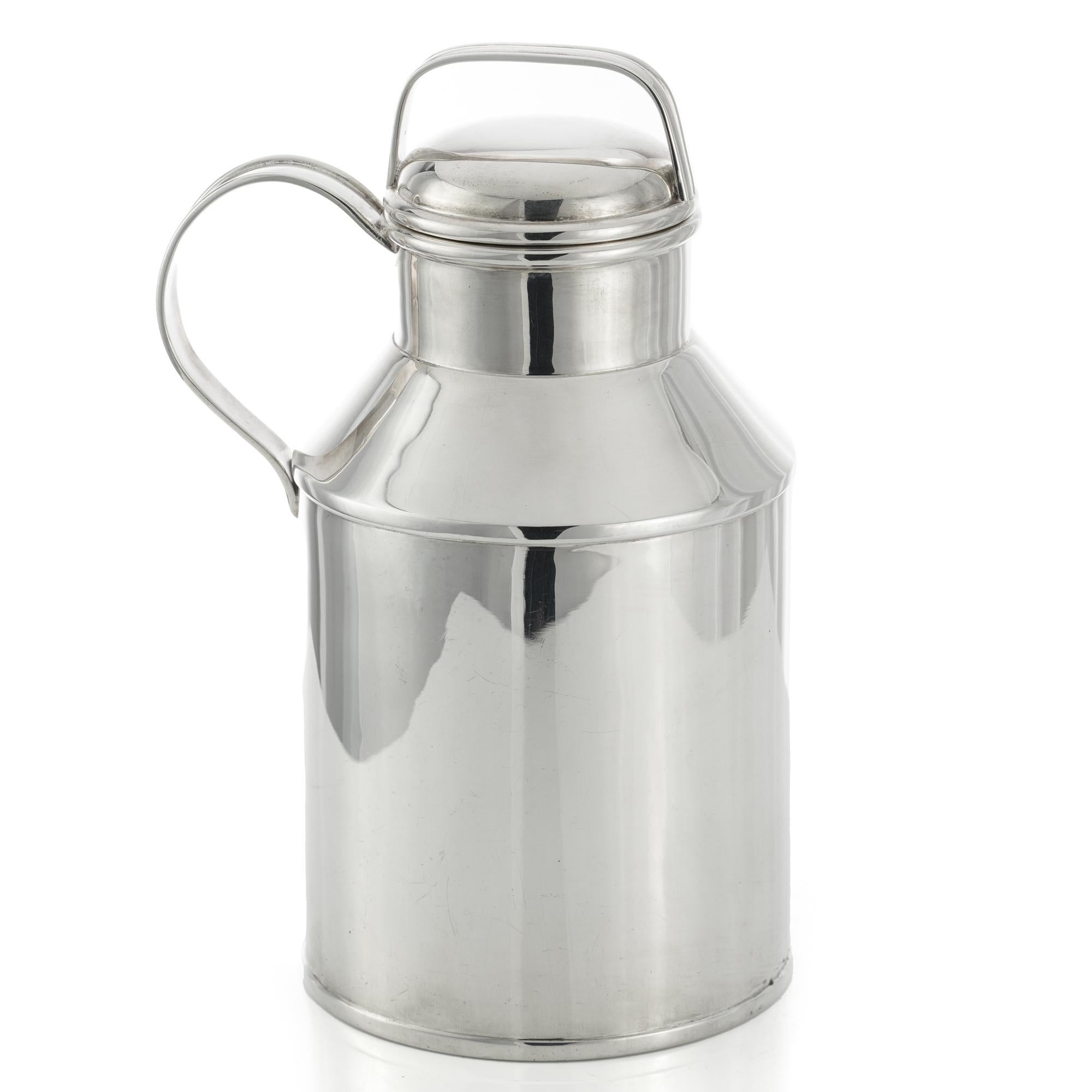 A novelty American 925 sterling silver 'milk can' cocktail shaker by Tuttle, Boston. 
Can designed with handle and pull-off cap, the cocktail shaker with bayonet-fitting strainer. 
Made in the United States. Ca.1933 - 1945
Retailed by Shreve,