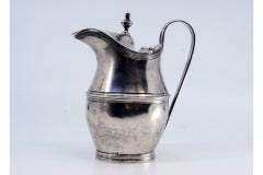 Silver milk jug with knobbed hinged lid, rim and base friezes, D. Maria style
