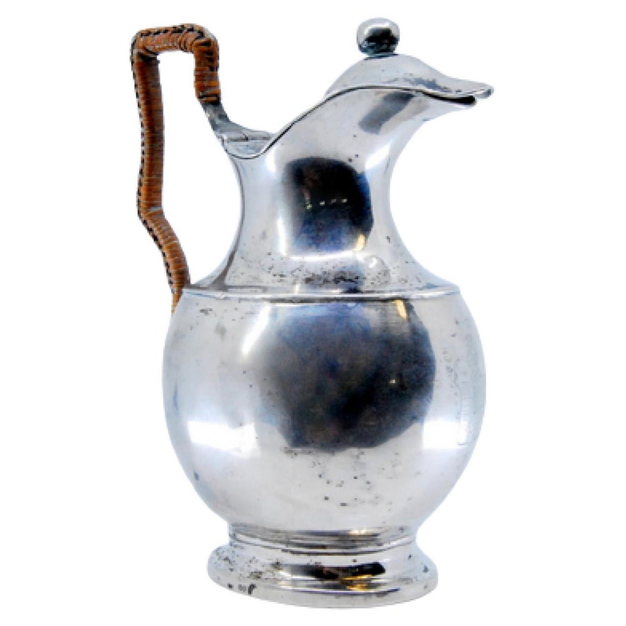 Silver milk jug with straw handle, knob on the lid and circular base