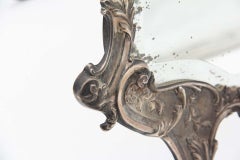 Specchio in argento con alti rilievi