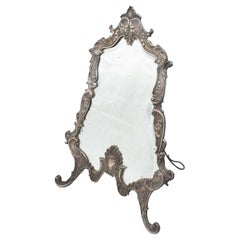Silver mirror with high reliefs