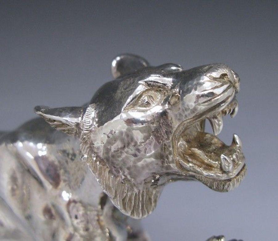 A very heavy silver model of a tiger, realistically modeled with one raised paw. Made by Mappin & Webb of London in 1991. 

Weight 126.00 troy ounces.