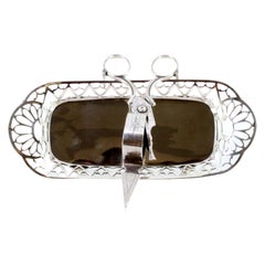 Silver morrões tray & scissors w/ cutouts, grid, reliefs & resting on four feet