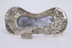 Silver morrões tray & scissors w/ floral reliefs & resting on four shell feet