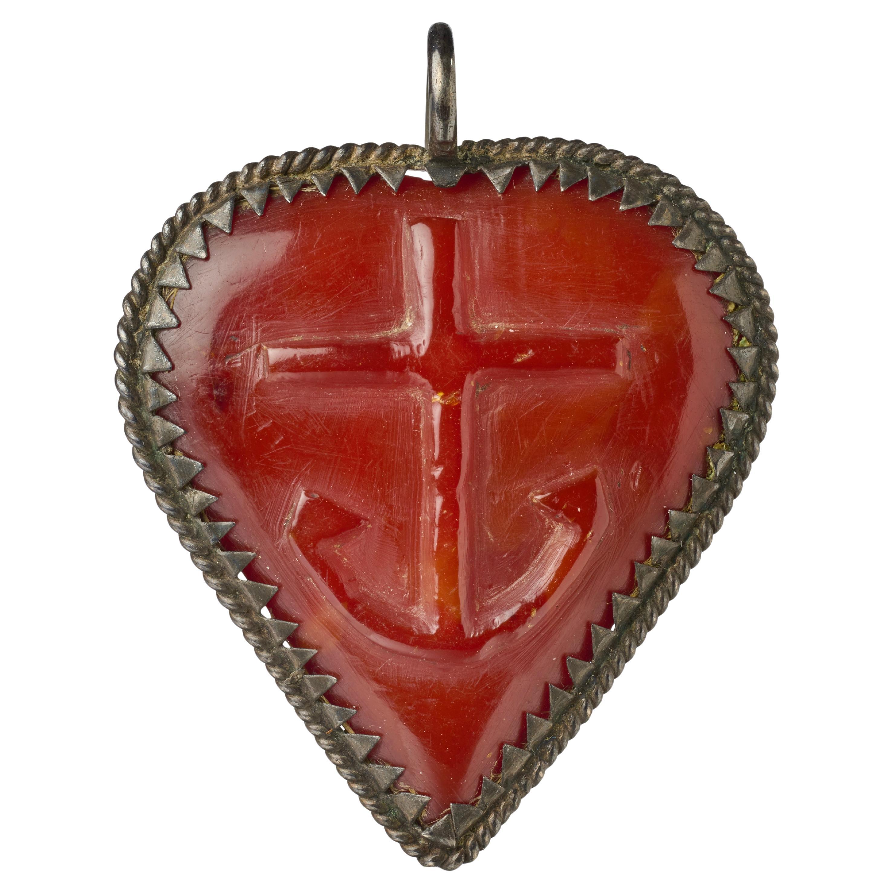 Silver-Mounted Amber Heart-Shaped Pendant. Germany, 17th century