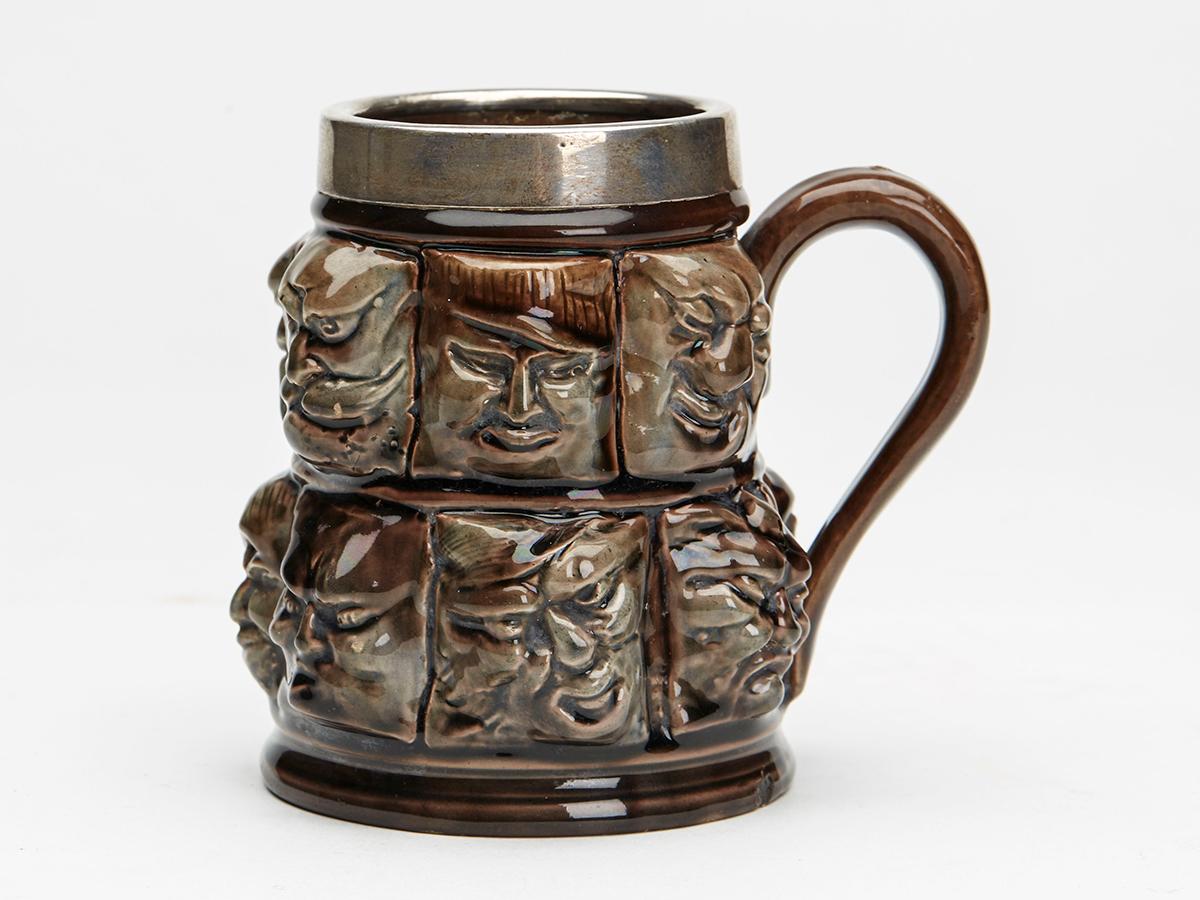 Silver Mounted Thirteen Grotesque Faces Molded Glazed Pottery Mug For Sale 1