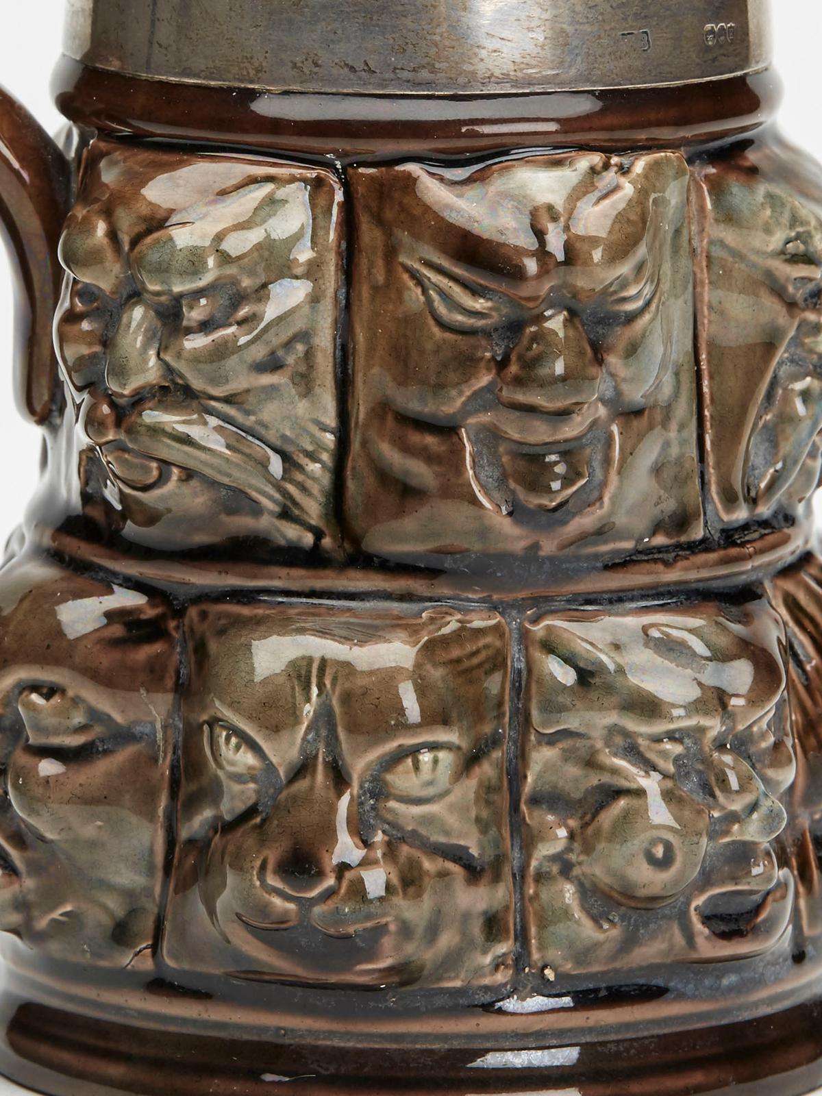 Silver Mounted Thirteen Grotesque Faces Molded Glazed Pottery Mug For Sale 7