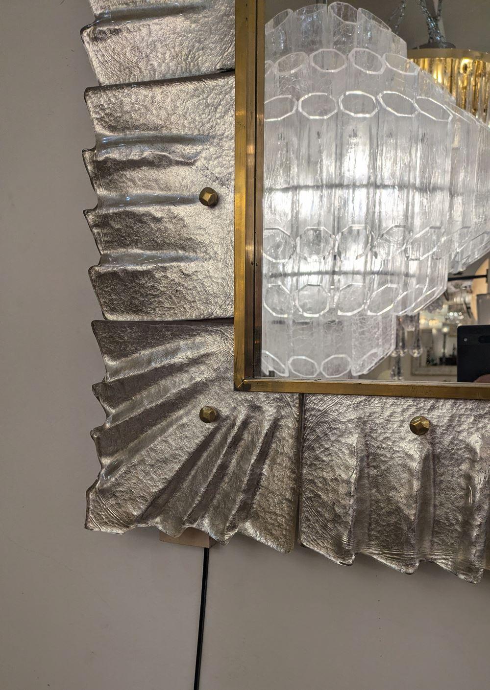 Silver Murano glass and brass mirror, 
(on wood panel)
Measures: 120 cm x 80 cm
Height or width position.
 