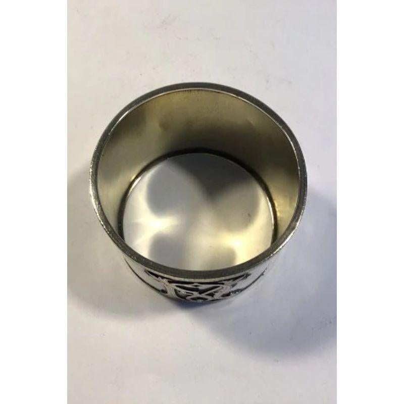 Silver Napkin ring gilt inside

Monogram, No Hallmarks inside 

Measures diameter 5 cm(2 in)Weight 38.5 gr/ 1.36 oz.
  