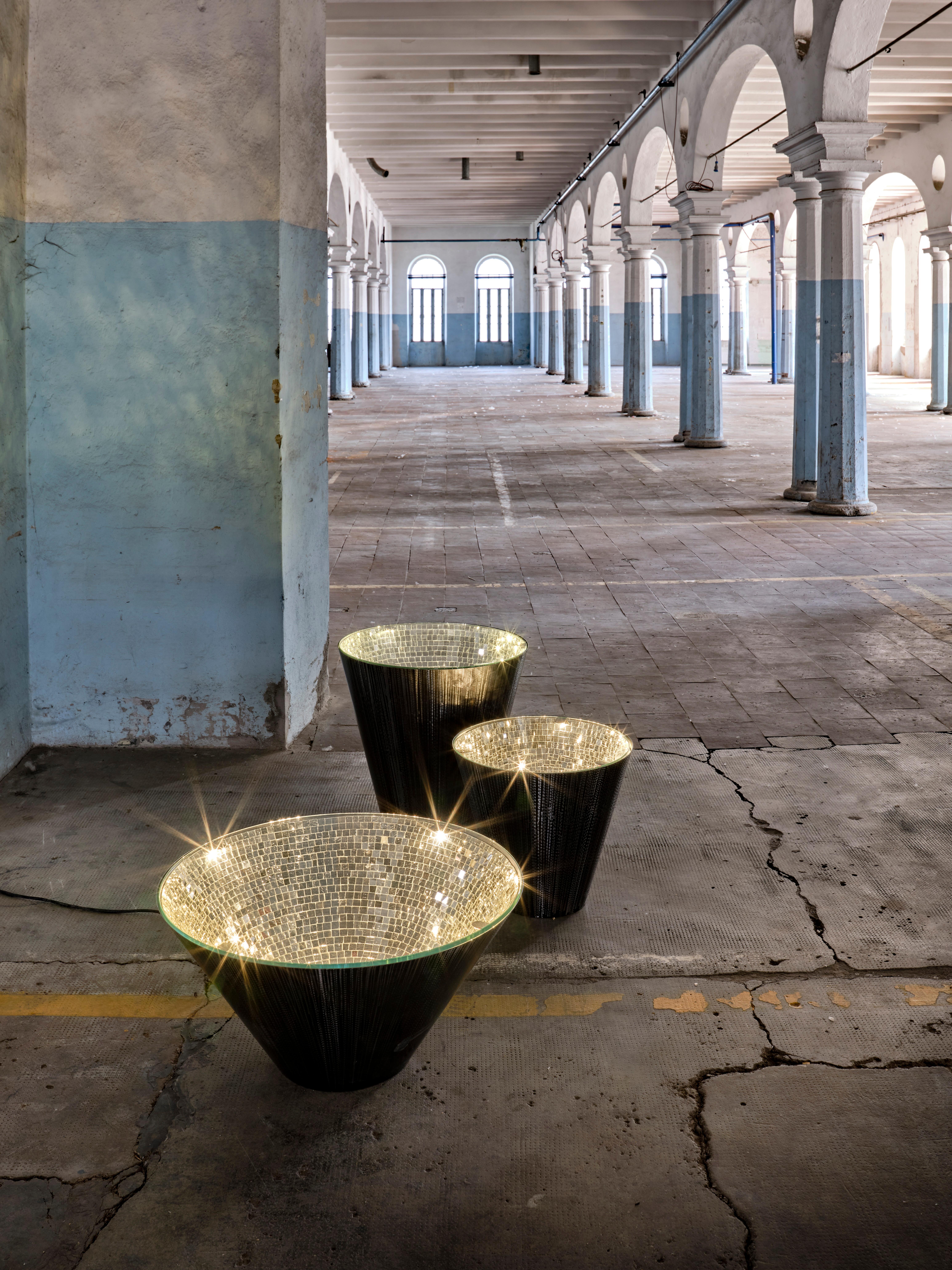 Silver Narciso table by Davide Medri.
Materials: mirror mosaic, iron.
Also available in gold. 
Dimensions: Ø 50 x H 45 cm.
Also available in Ø 60 x H 60, Ø 80 x H 40 cm.

Davide Medri was born in Cesena on August 7th 1967 and graduated at the