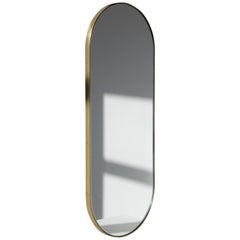 Silver Narrow Capsula Mirror with a Brass Frame