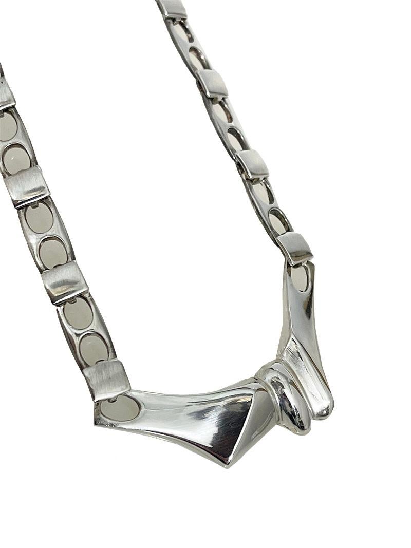 Silver Necklace designed by Björn Weckström for Lapponia, 1960s

A silver pendant with link chain designed by Björn Weckström for Lapponia. Fully hallmarked with the Finnish silver hall marks. Design no. F8. 925 Sterling silver. With maker's mark