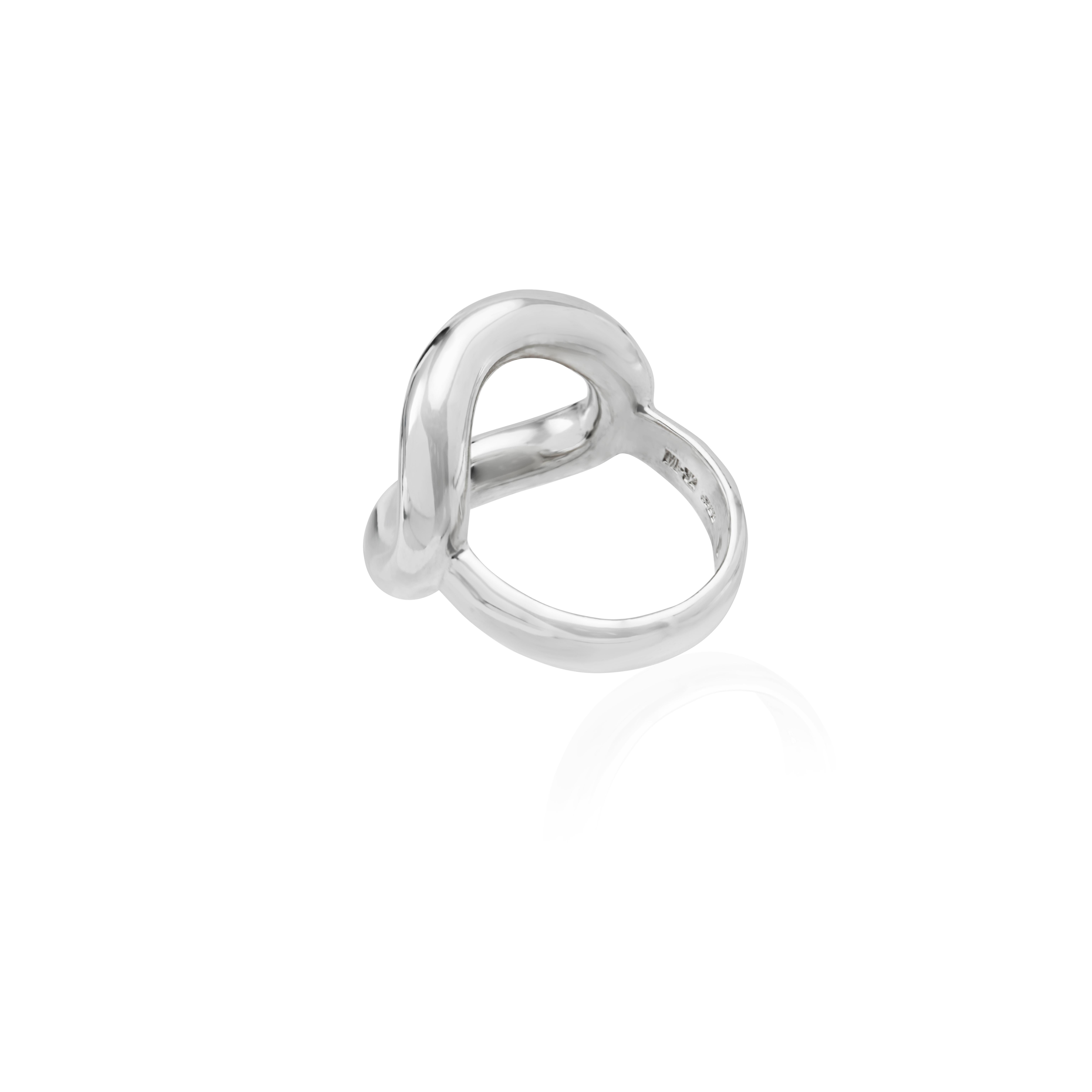 This handmade sterling silver ring is a stunning representation of perfectly balanced geometry. The sensitivity of the artist Xawery Wolski has allowed him to convert his magnificent work into small and detailed pieces, thus making his way into the