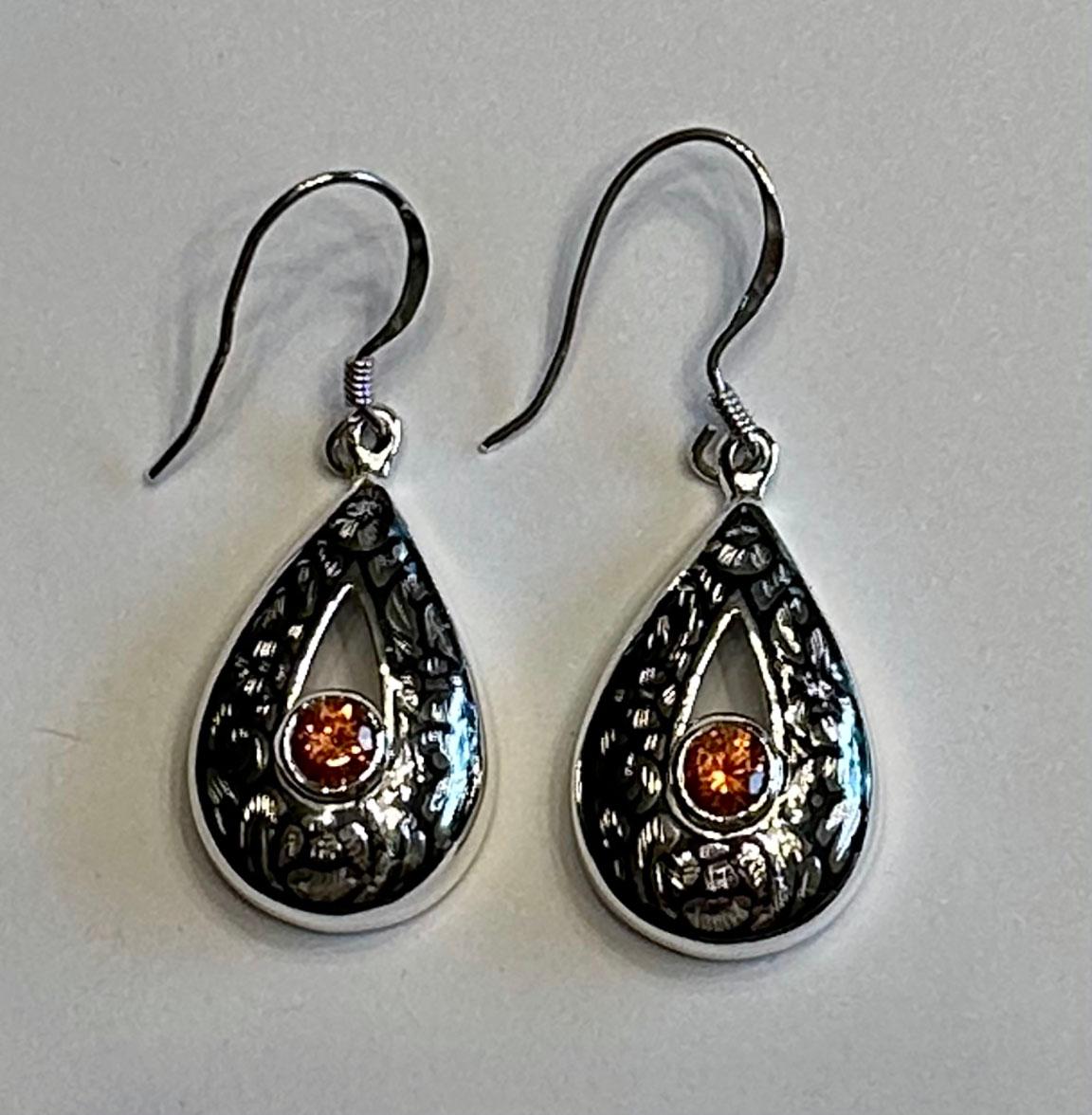 Artisan Silver Nielloware Earrings set with Orange Sapphires For Sale