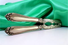 Silver nutcracker with engravings and shell friezes on the handles