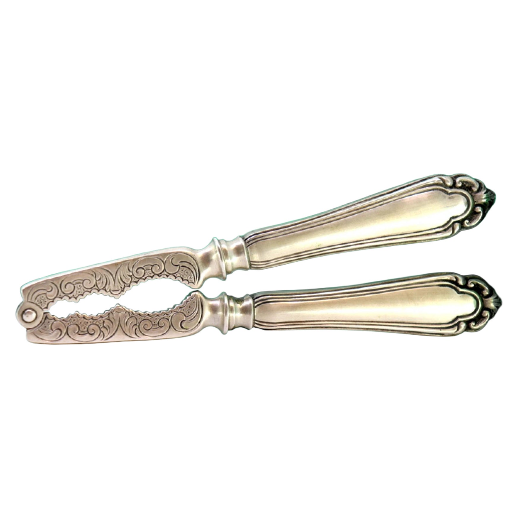 Silver nutcracker with engravings and shell friezes on the handles