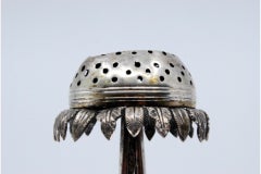 Silver obelisk-and-flower toothpick holder on floral three-foot base