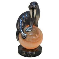 Silver on Bronze Seal Laying on an Onyx Ball Lamp