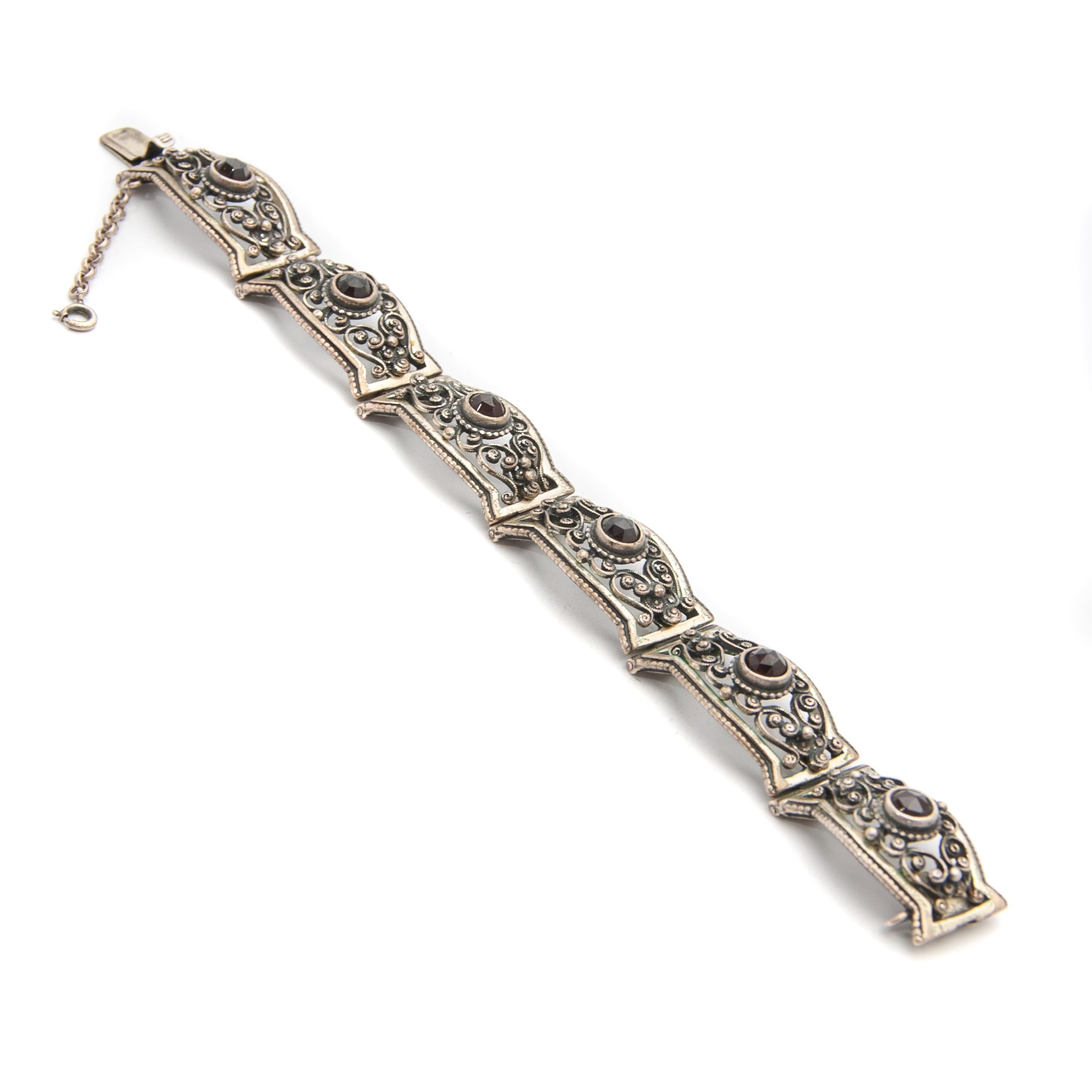 silver bracelet with garnet stone