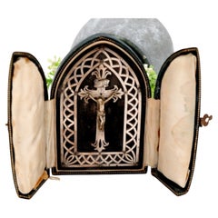 Silver oratory with reliefs, cutouts, and crucified Christ in case