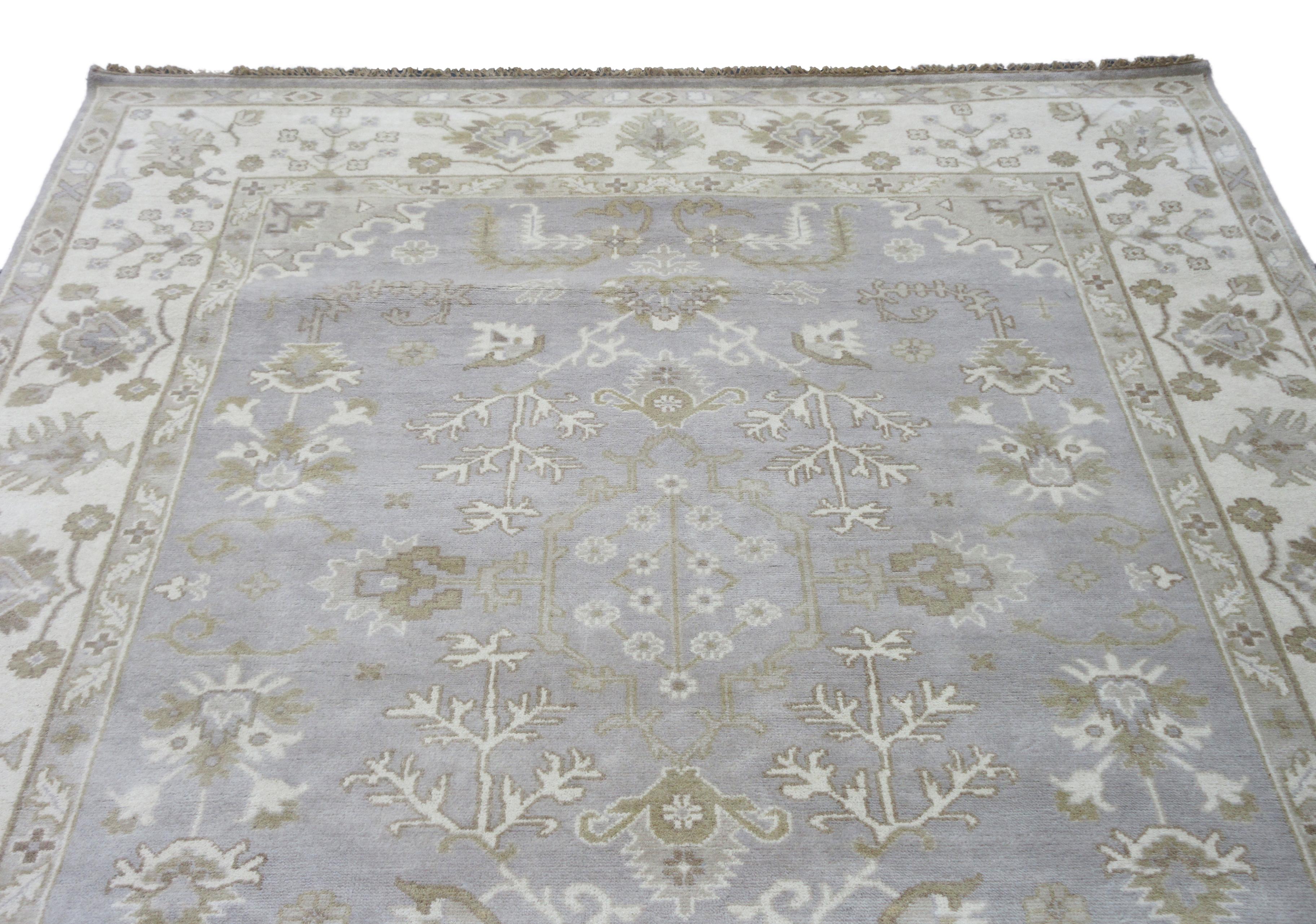 Hand-knotted, wool pile on a cotton foundation.

Dimensions: 9' x 12'

Origin: India

Field Color: Silver

Border Color: Ivory

Accent Colors: Brown, Gray.