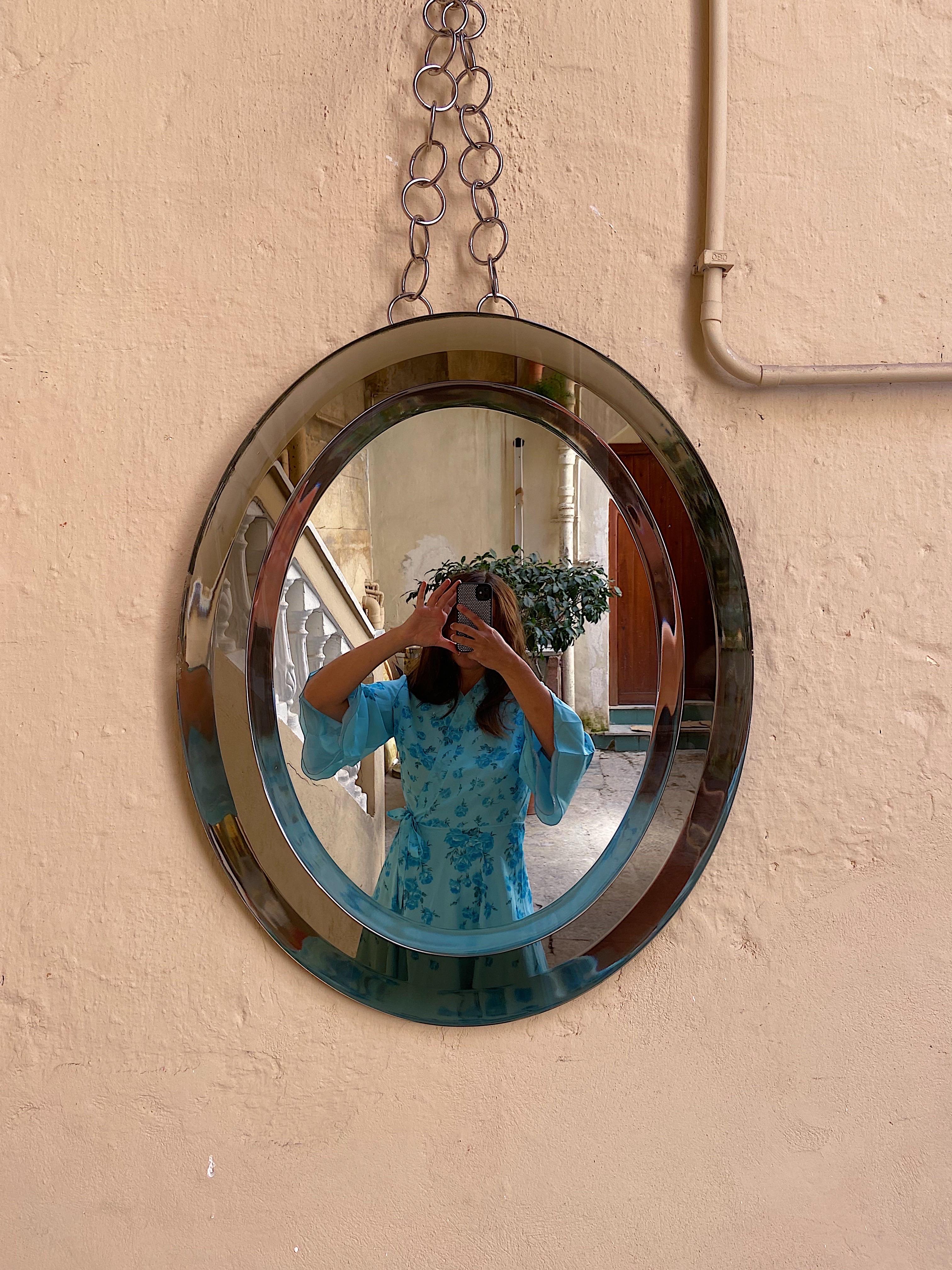 Breathtaking midcentury wall mirror from the creator Crystal Arte. This fantastic piece was produced in 1960s, Italy, Torino. It has a beautiful frame glass in ”silver-fume ” very rare since they mostly were produced in blue.
Notice that the mirror