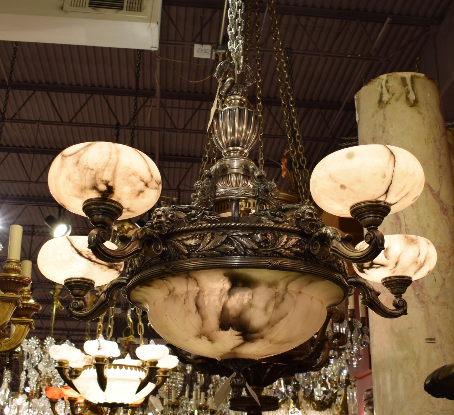 A fine silver over bronze & alabaster chandelier. France, circa 1920.
Dimensions: Height 30