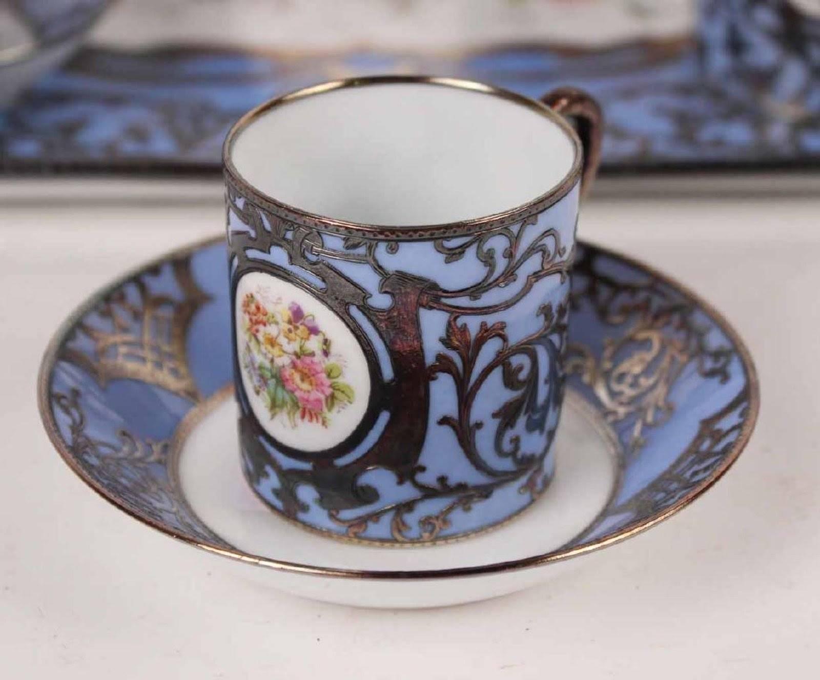 Austrian, 19th century comprising a tray, teapot, sugar bowl, creamer and six cups and saucers. 16 pieces.
