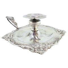 Silver paddle, cut and embossed with floral motifs