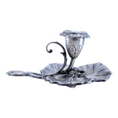 Silver paddle in the shape of a leaf with reliefs