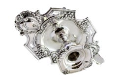 Silver paddle w/ cut-out floral motifs & applications involving a monogram card