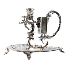 Silver paddle w/ cut-out reliefs, floral motifs, garlands & matchbox appliqué