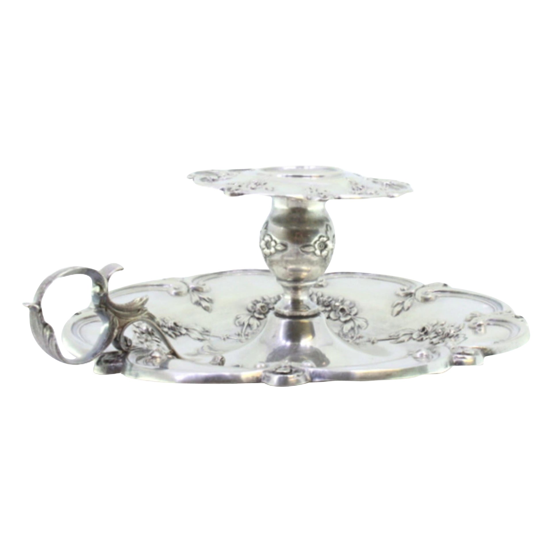 Silver paddle w/ raised floral motifs 
acanthus leaf applications on the handle