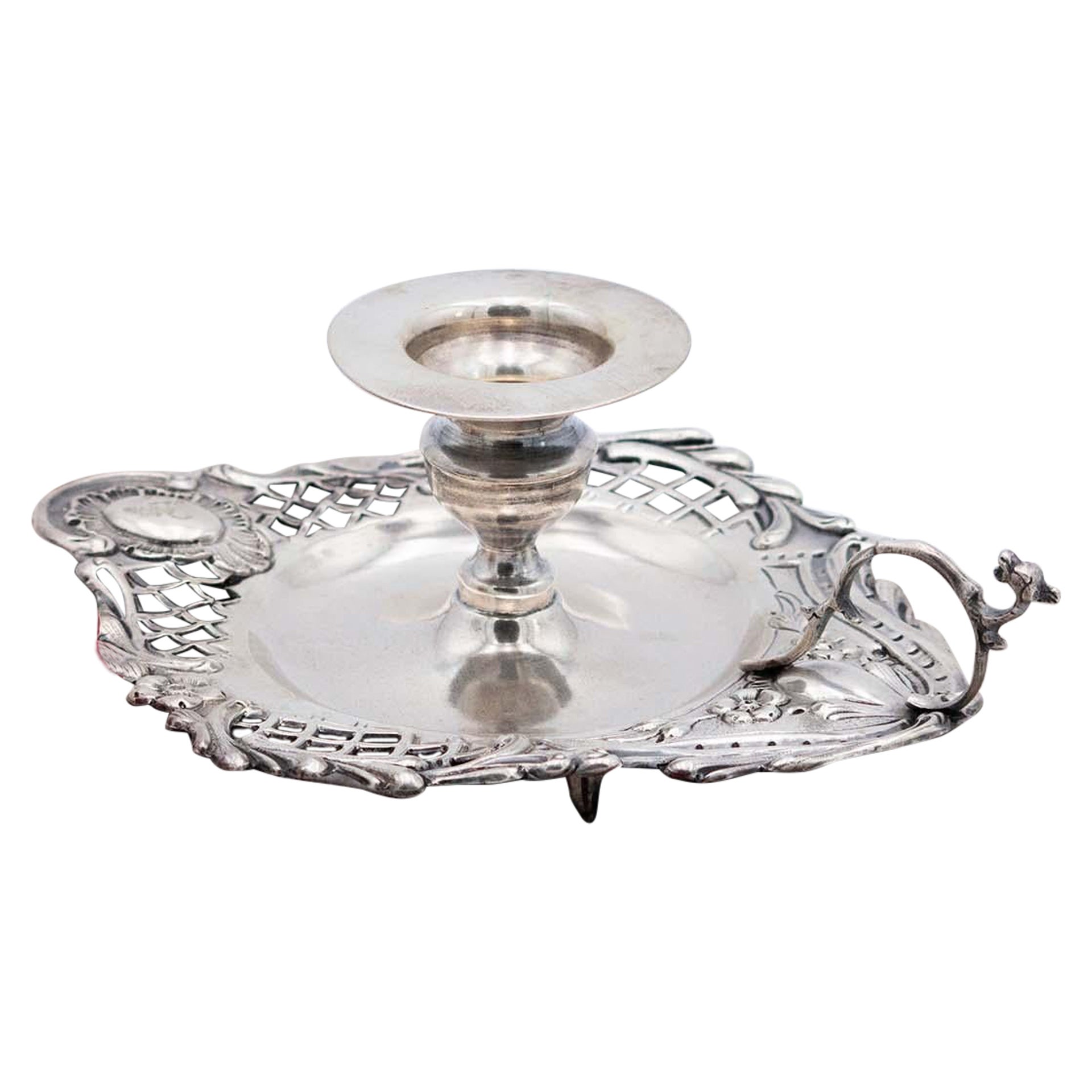 Silver paddle with embossed floral motifs