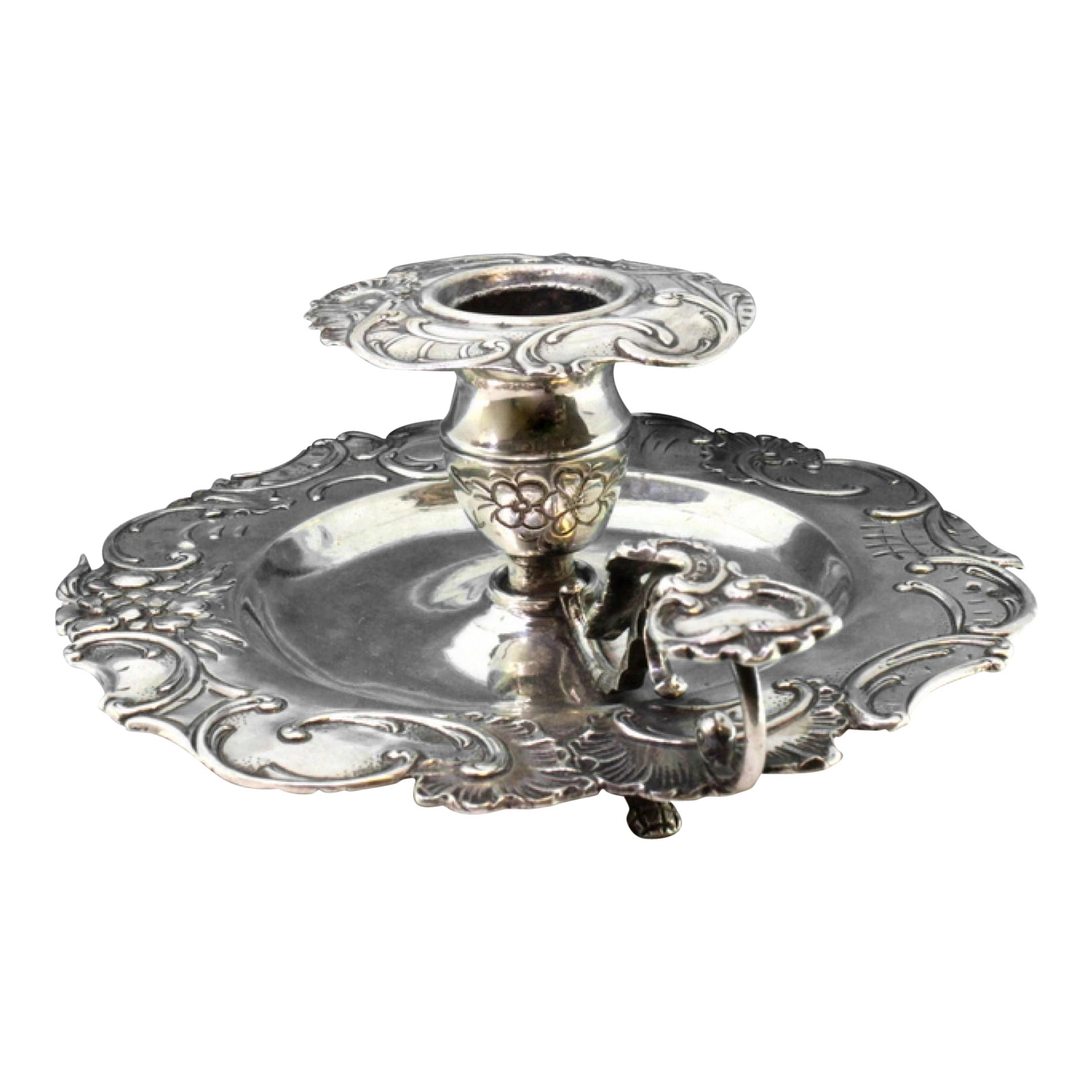 Silver paddle with embossed florals, cutout surround, and monogram handle