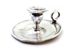 Silver paddle with engraved floral motifs